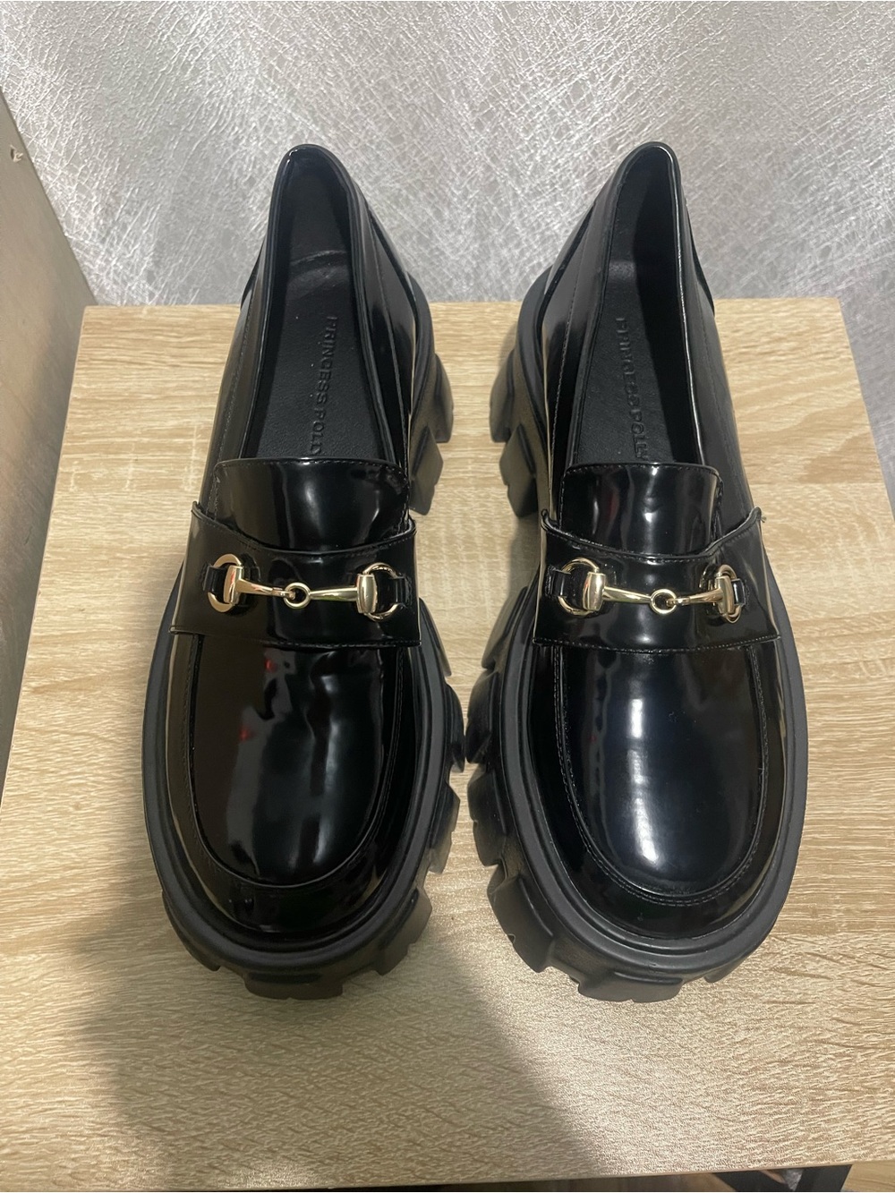 Princess Polly black faux leather loafers with gold hardware